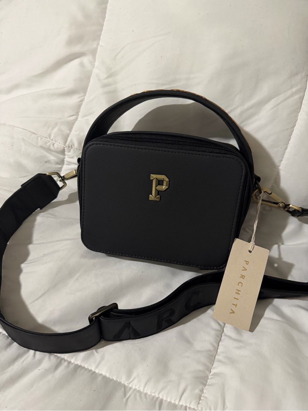 Black Crossbody Bag with Gold 'P' Accent